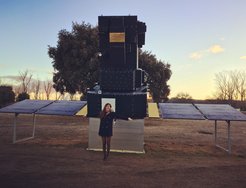 Miho Janvier in front of a model (not to scale) of the ESA satellite called SoHO.